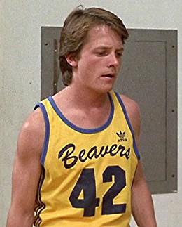 Michael J Fox as Scott Howard wearing Beavers 42 yellow tank top